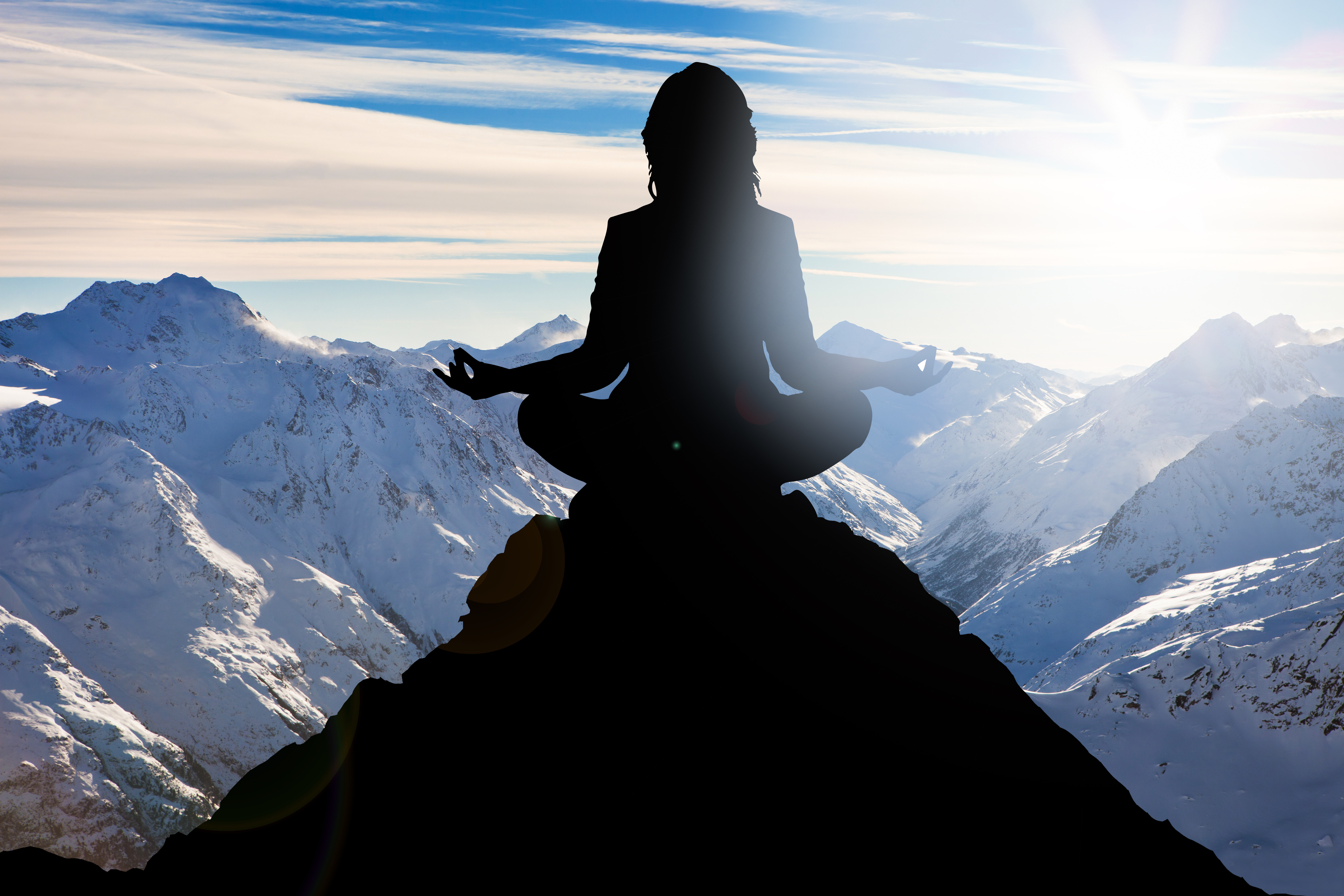 Silhouette Of A Woman Performing Yoga On Mountain Peak