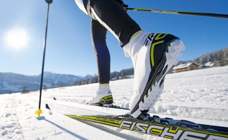 Close up on the boots and skis of a cross-country skier