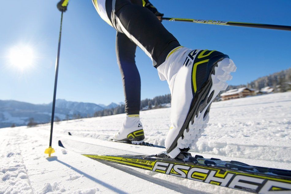 Close up on the boots and skis of a cross-country skier
