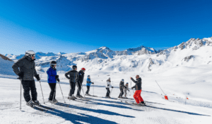 Skiers standing on the mountain