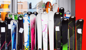 Variety of skis lined up.